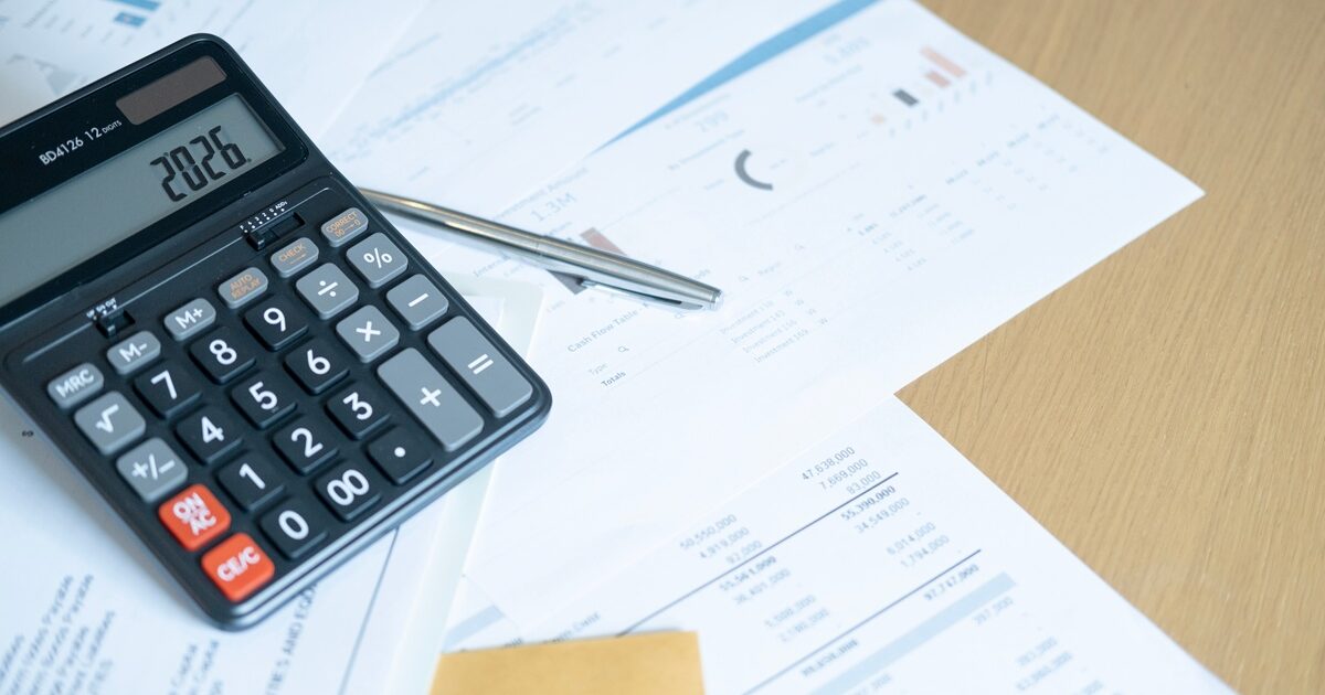 Closeup,Of,Calculator,With,2026,And,Pen,On,Reports,,Illustrating